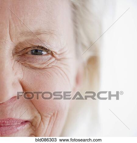 Stock Image - Close up of smiling Caucasian woman. Fotosearch