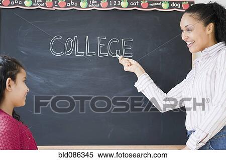 Girl watching teacher write the word "college" on blackboard View Large Photo Image Stock Photography - Girl watching teacher write the word "college" on blackboard. Fotosearch