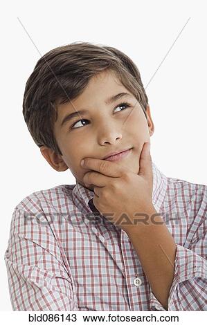 Stock Image - Hispanic boy thinking. Fotosearch