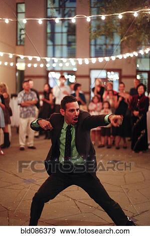 Stock Photo - Man dancing at wedding reception. Fotosearch