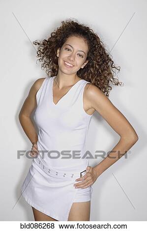Mixed race woman standing with hands on hips View Large Photo Image Stock Photo - Mixed race woman standing with hands on hips. Fotosearch