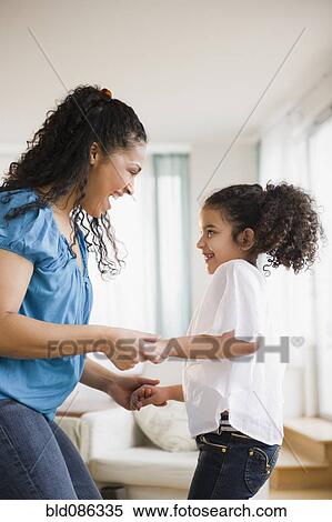 Stock Photography - Mother and daughter dancing. Fotosearch