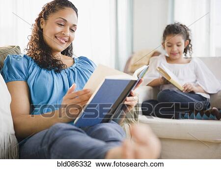 Mother and daughter reading books View Large Photo Image Stock Image - Mother and daughter reading books. Fotosearch
