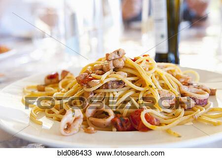 Plate of calamari spaghetti View Large Photo Image Stock Image - Plate of calamari spaghetti. Fotosearch