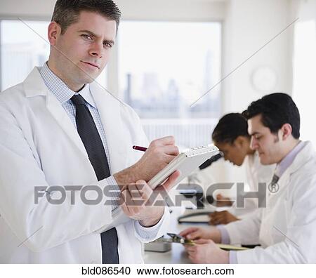 Scientist writing on clipboard in laboratory View Large Photo Image Stock Image - Scientist writing on clipboard in laboratory. Fotosearch