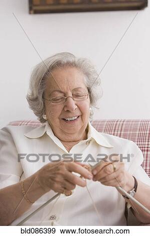 Stock Photo - Senior Chilean woman knitting. Fotosearch