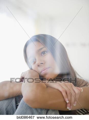 Serious Hispanic teenager thinking View Large Photo Image Stock Photo - Serious Hispanic teenager thinking. Fotosearch
