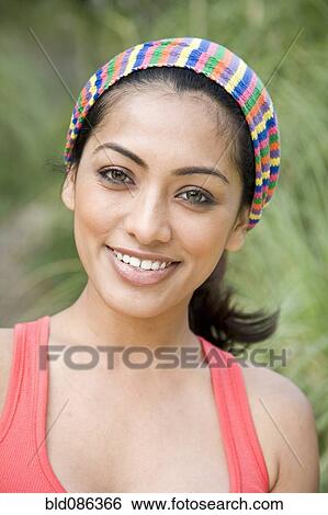 Smiling Indian woman outdoors View Large Photo Image Stock Photograph - Smiling Indian woman outdoors. Fotosearch