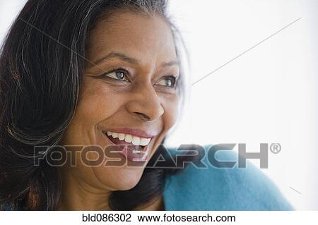 Stock Image - Smiling mixed race woman. Fotosearch