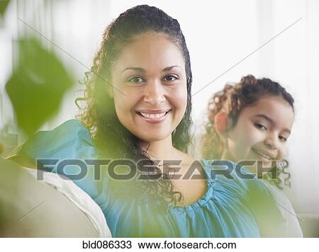 Stock Image - Smiling mother and daughter. Fotosearch