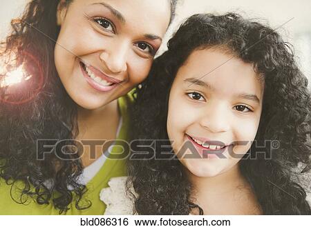 Stock Photograph - Smiling mother and daughter. Fotosearch
