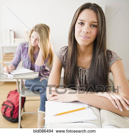 Teenage girls studying in classroom View Large Photo Image Picture - Teenage girls studying in classroom. Fotosearch
