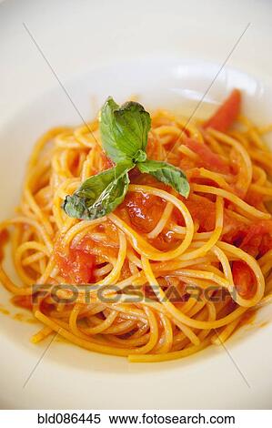Stock Photography - Tuscan spaghetti with basil. Fotosearch