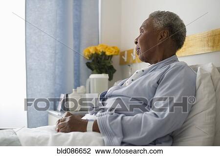 Black woman recovering in hospital bed View Large Photo Image Stock Image - Black woman recovering in hospital bed. Fotosearch