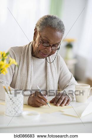 Black woman writing letter View Large Photo Image Stock Image - Black woman writing letter. Fotosearch