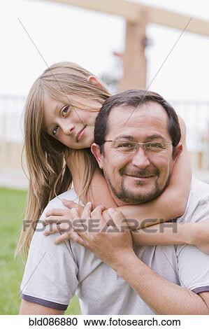 Chilean father and daughter hugging outdoors View Large Photo Image Stock Image - Chilean father and daughter hugging outdoors. Fotosearch
