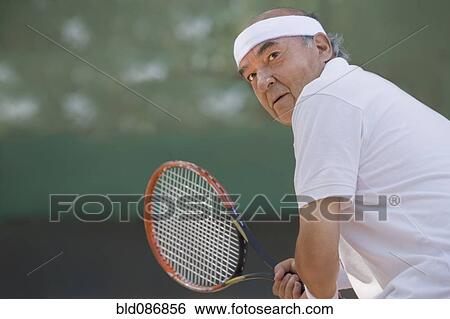 Stock Photograph - Chilean man playing tennis. Fotosearch