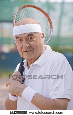Stock Photography - Chilean man playing tennis. Fotosearch