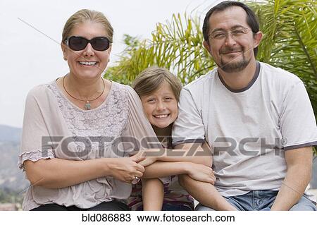 Chilean mother and daughter sitting outdoors View Large Photo Image Stock Image - Chilean mother and daughter sitting outdoors. Fotosearch
