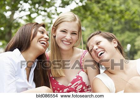 Picture - Friends laughing together. Fotosearch