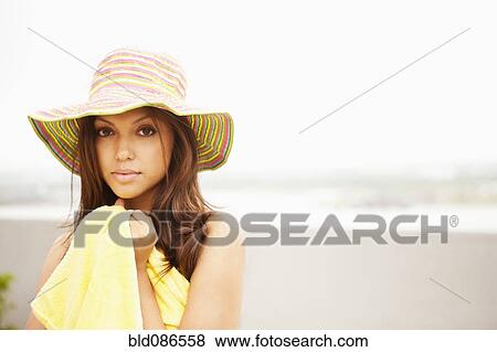 Stock Photo - Hispanic woman enjoying the beach. Fotosearch