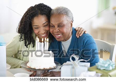 Mother and daughter celebrating birthday View Large Photo Image Stock Photo - Mother and daughter celebrating birthday. Fotosearch