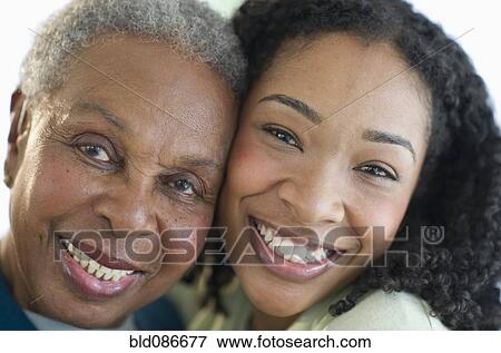 Stock Photo - Mother and daughter hugging. Fotosearch