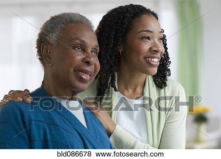 Stock Photo - Mother and daughter hugging. Fotosearch