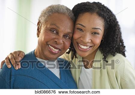 Stock Photograph - Mother and daughter hugging. Fotosearch