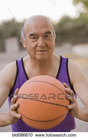Senior Chilean man playing basketball View Large Photo Image Stock Image - Senior Chilean man playing basketball. Fotosearch