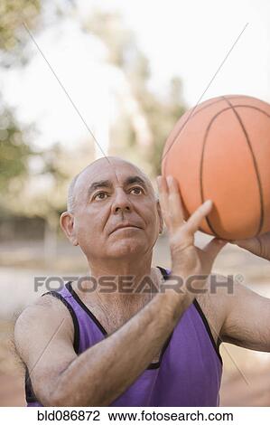Senior Chilean man playing basketball View Large Photo Image Stock Image - Senior Chilean man playing basketball. Fotosearch
