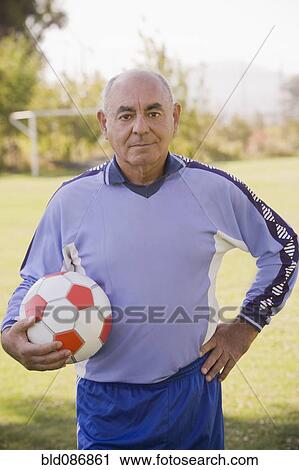 Senior Chilean soccer player holding soccer ball View Large Photo Image Stock Image - Senior Chilean soccer player holding soccer ball. Fotosearch