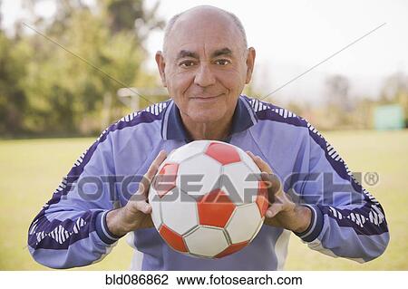 Senior Chilean soccer player holding soccer ball View Large Photo Image Stock Image - Senior Chilean soccer player holding soccer ball. Fotosearch