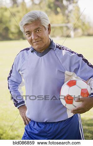 Senior Chilean soccer player holding soccer ball View Large Photo Image Stock Photo - Senior Chilean soccer player holding soccer ball. Fotosearch
