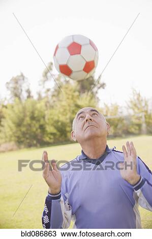 Senior Chilean soccer player throwing soccer ball View Large Photo Image Stock Image - Senior Chilean soccer player throwing soccer ball. Fotosearch