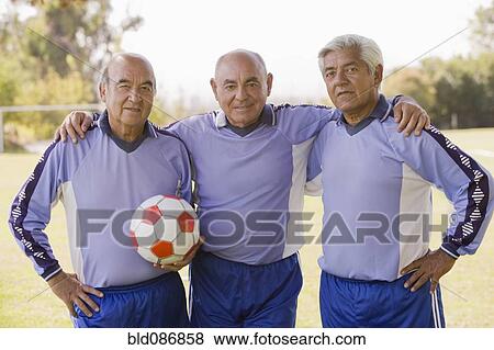 Stock Photo - Senior Chilean soccer players standing together. Fotosearch