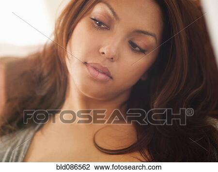 Stock Image - Serious Hispanic woman. Fotosearch