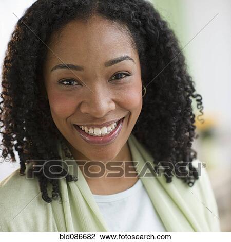 Stock Image - Smiling mixed race woman. Fotosearch