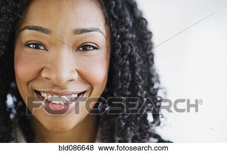 Stock Photo - Smiling mixed race woman. Fotosearch