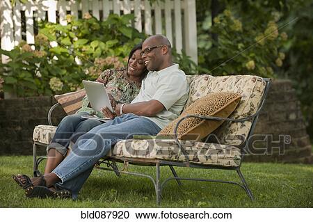 African American couple using digital tablet outdoors View Large Photo Image Stock Image - African American couple using digital tablet outdoors. Fotosearch