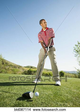 Black golfer preparing to swing golf club View Large Photo Image Picture - Black golfer preparing to swing golf club. Fotosearch