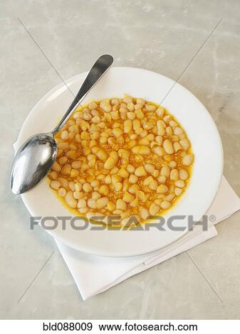 Stock Photo - Bowl of Tuscan beans with tomato sauce. Fotosearch