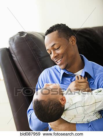 Father playing with son View Large Photo Image Stock Photo - Father playing with son. Fotosearch