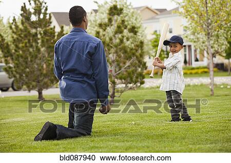 Father teaching son to play baseball View Large Photo Image Stock Image - Father teaching son to play baseball. Fotosearch