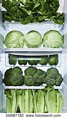 Stock Image - Green vegetables in refrigerator. Fotosearch