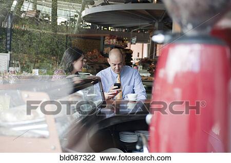 Hispanic couple together in cafe View Large Photo Image Stock Image - Hispanic couple together in cafe. Fotosearch