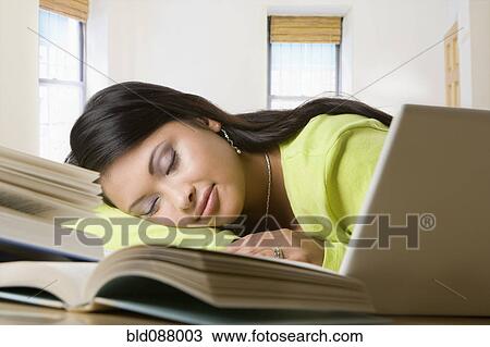 Hispanic woman sleeping on books View Large Photo Image Stock Image - Hispanic woman sleeping on books. Fotosearch