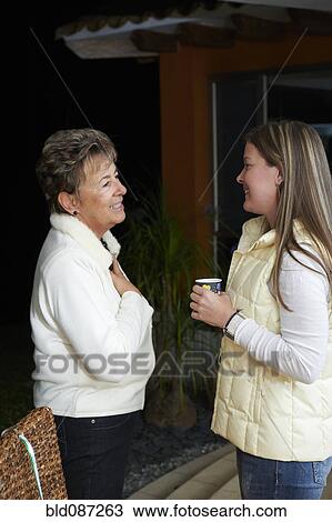 Hispanic women talking together View Large Photo Image Stock Image - Hispanic women talking together. Fotosearch