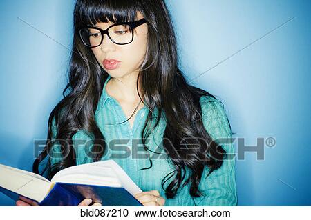 Mixed race woman reading book View Large Photo Image Stock Image - Mixed race woman reading book. Fotosearch