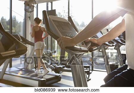 People exercising in health club View Large Photo Image Stock Photo - People exercising in health club. Fotosearch